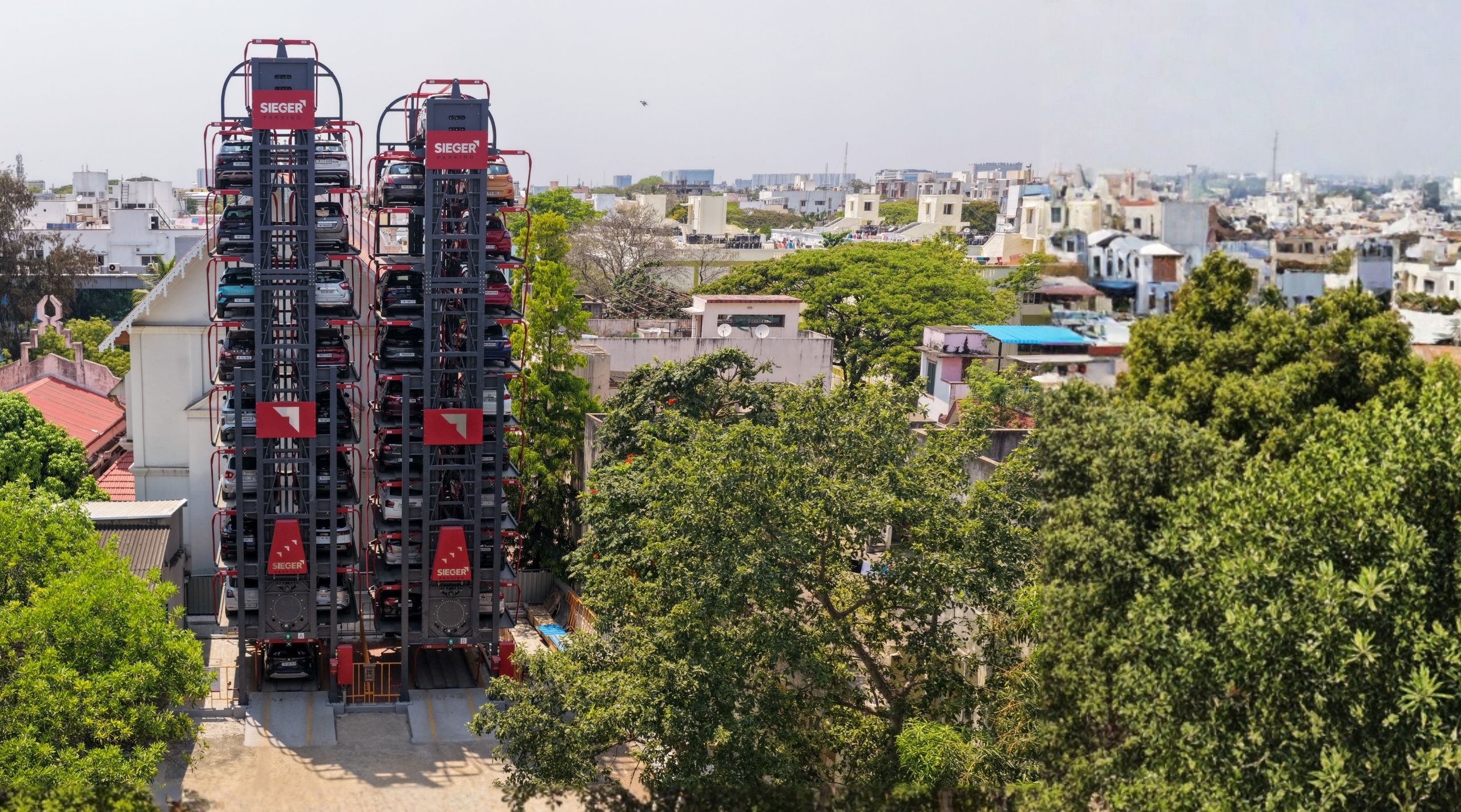 Rotary parking system using a circular Ferris-wheel mechanism to store and retrieve cars